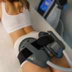 Woman receiving a laser treatment on her leg in a clinical setting