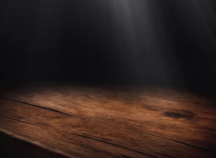 Dark wooden table with a spotlight effect